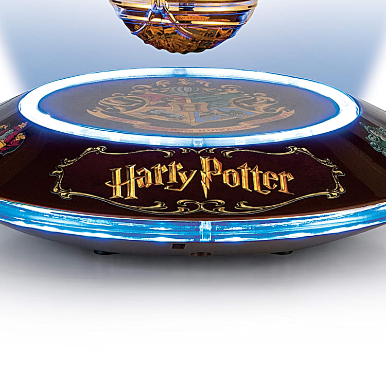 The Harry Potter Levitating Golden Snitch Sculpture with Light Up Base