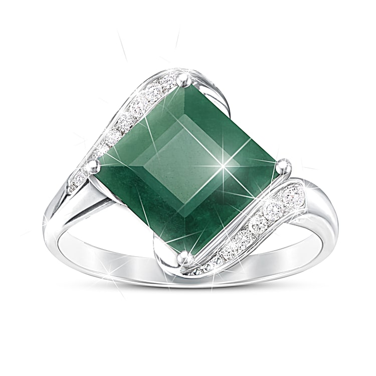 Sterling Silver Ring Featuring An Emerald Center Stone Accented With 12 White Topaz Gemstones