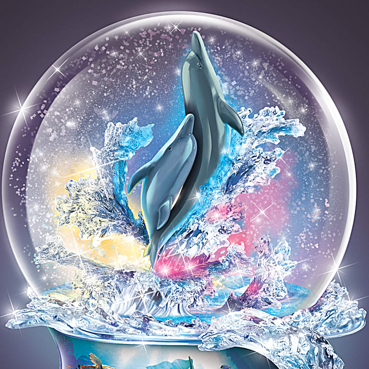 Oceans Treasures Illuminated Color Changing Dolphin Glitter Globe Featuring A Porcelain Base Adorned With Aquatic Art By Artist David Penfound