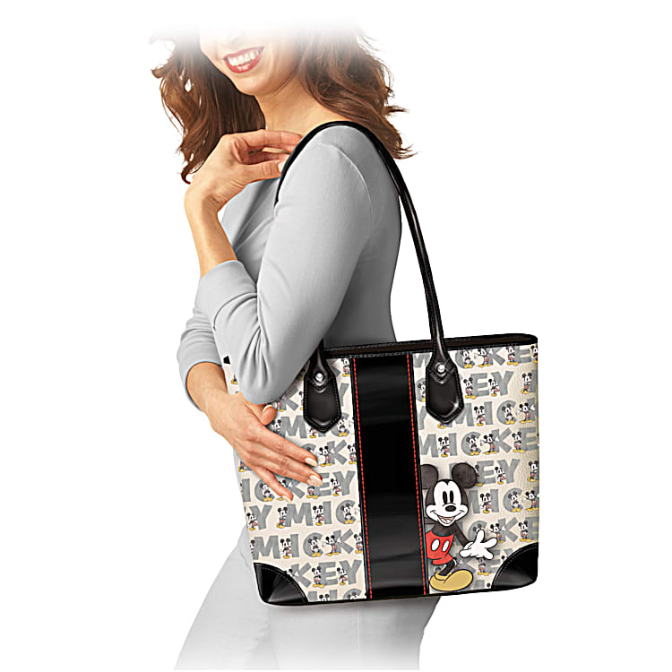 Disneys Mickey Mouse Iconic Black Faux Leather Tote Bag Featuring An All Over Pattern Of Mickey Mouse And His Name Spelled Out In Block Letters