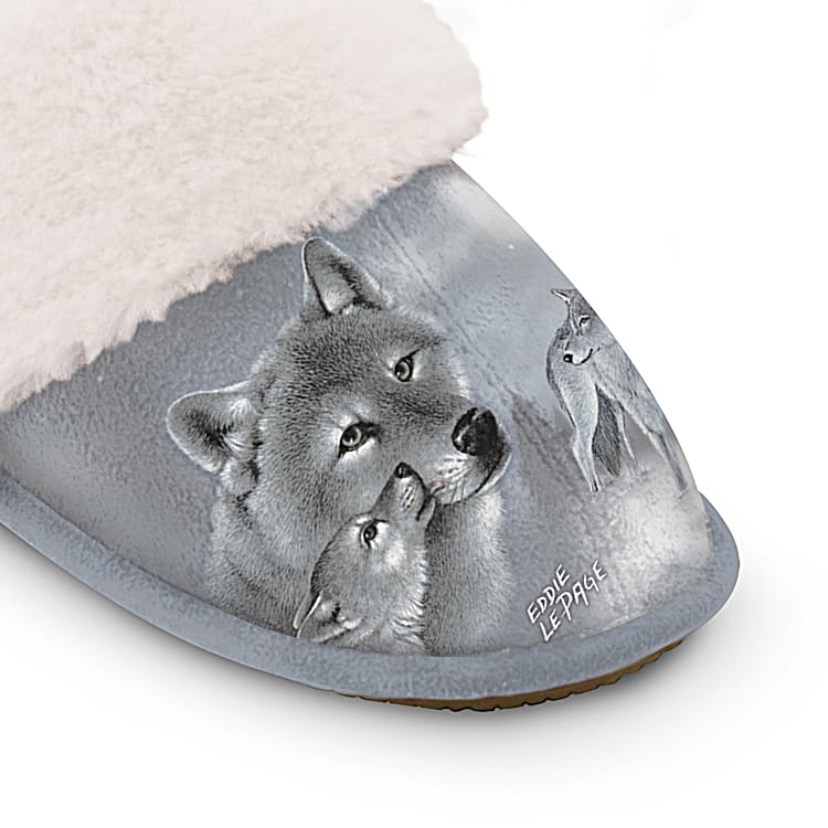 Guardians Of The Wild Gray Faux Suede Slippers Adorned With Wolf Art By Artist Eddie LePage And Feature A Flexible Sole Lined With Cozy Faux Fur