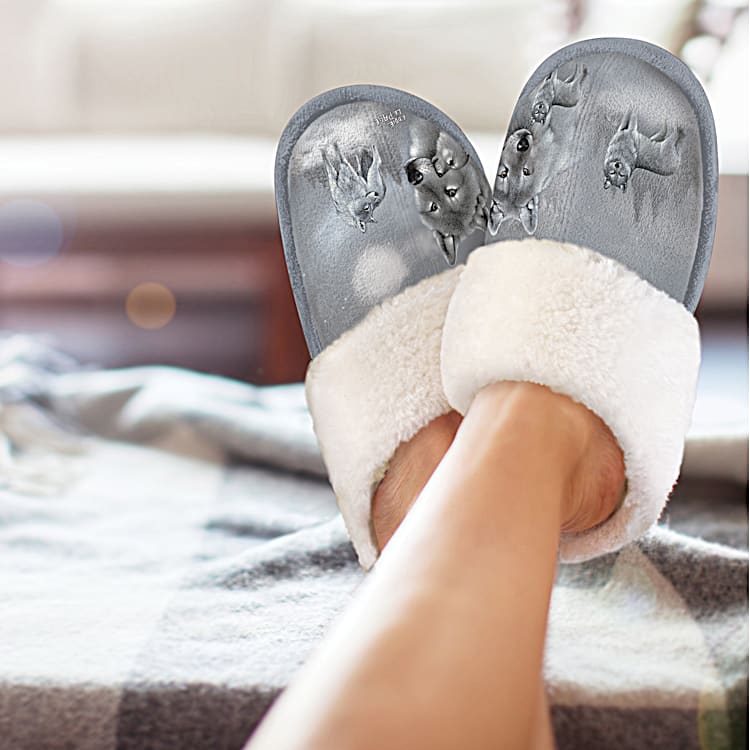 Guardians Of The Wild Gray Faux Suede Slippers Adorned With Wolf Art By Artist Eddie LePage And Feature A Flexible Sole Lined With Cozy Faux Fur