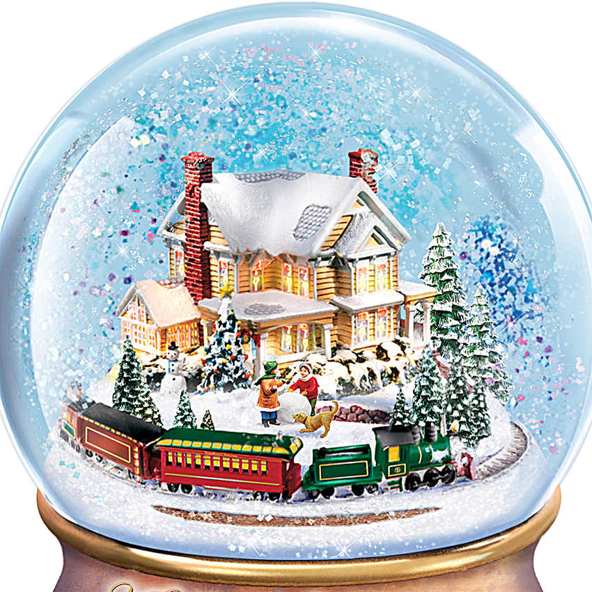 Holiday Snowglobes Featuring Rotating Motion And Adorned With
