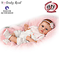 Lifelike Interactive Baby Doll Really "Holds" Your Hand